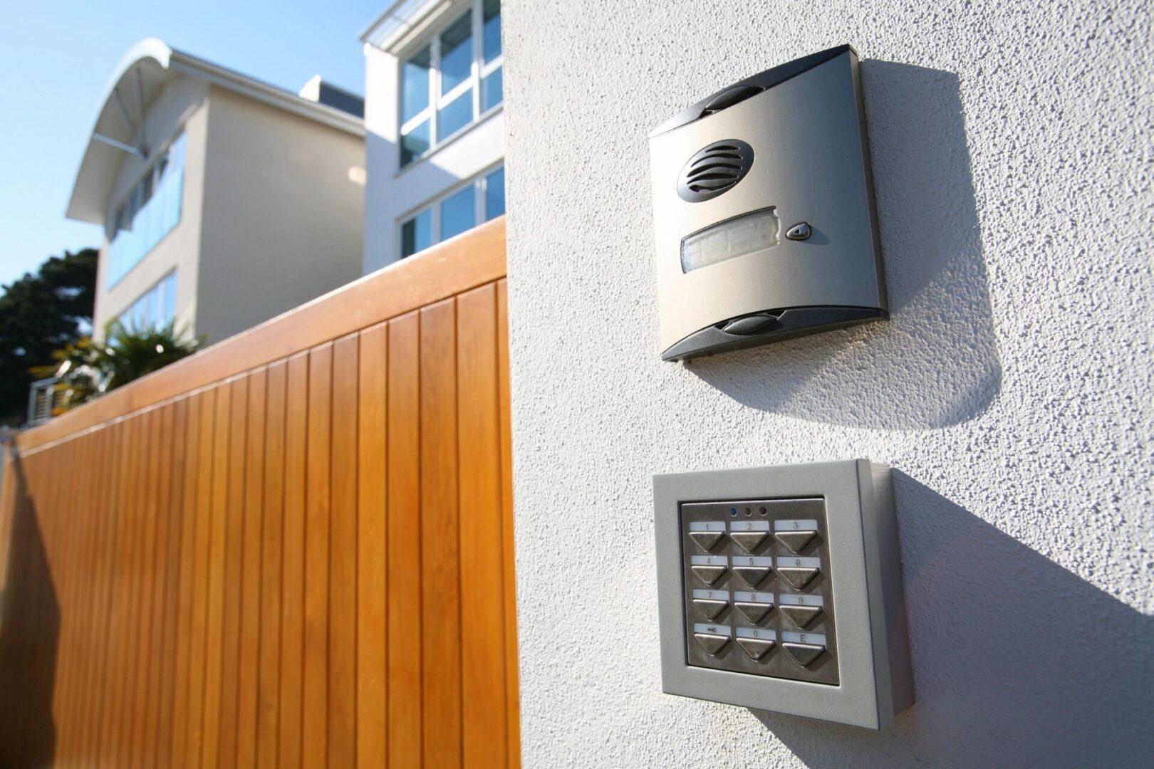 A close up of a door bell and a keypad